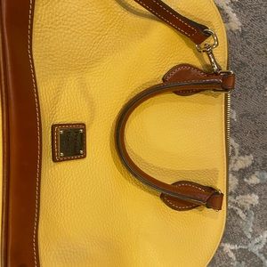 Beautiful Dooney N Bourke purse. Yellow. Leather. Gently used